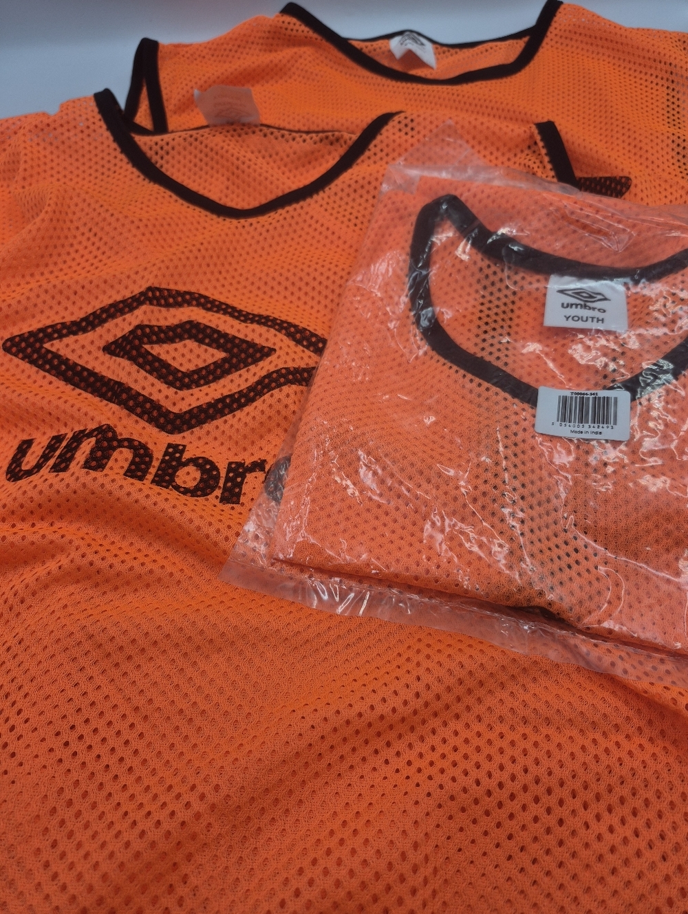 3 Umbro Orange Youth Mesh Training Bib with Black Trim. Never Worn.